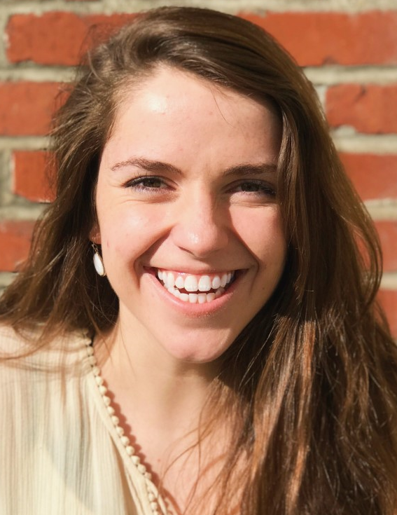 girl with brown hair smiling