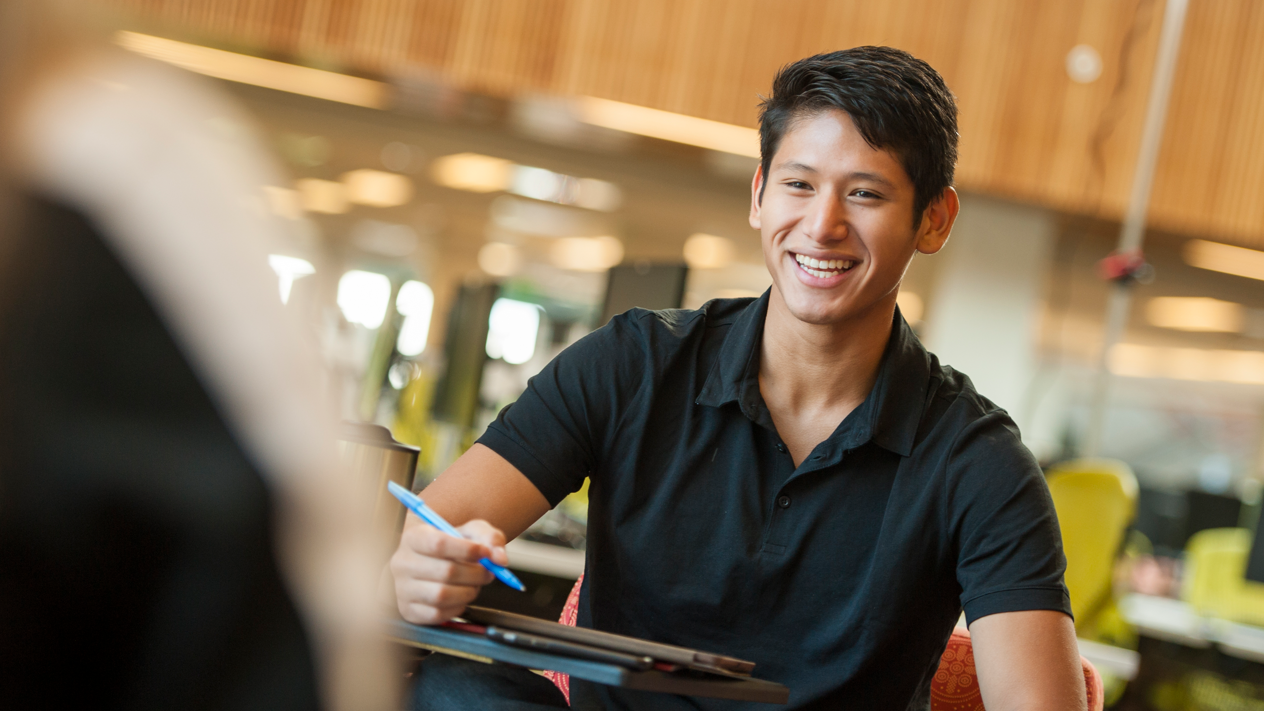 student in library